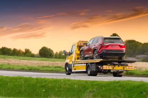Tow truck providing fast towing and roadside assistance to a disabled vehicle in Humble, TX