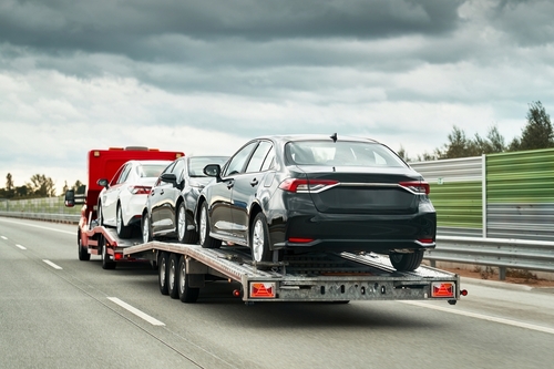 Tow truck providing towing and roadside assistance to a disabled vehicle in South Houston, TX